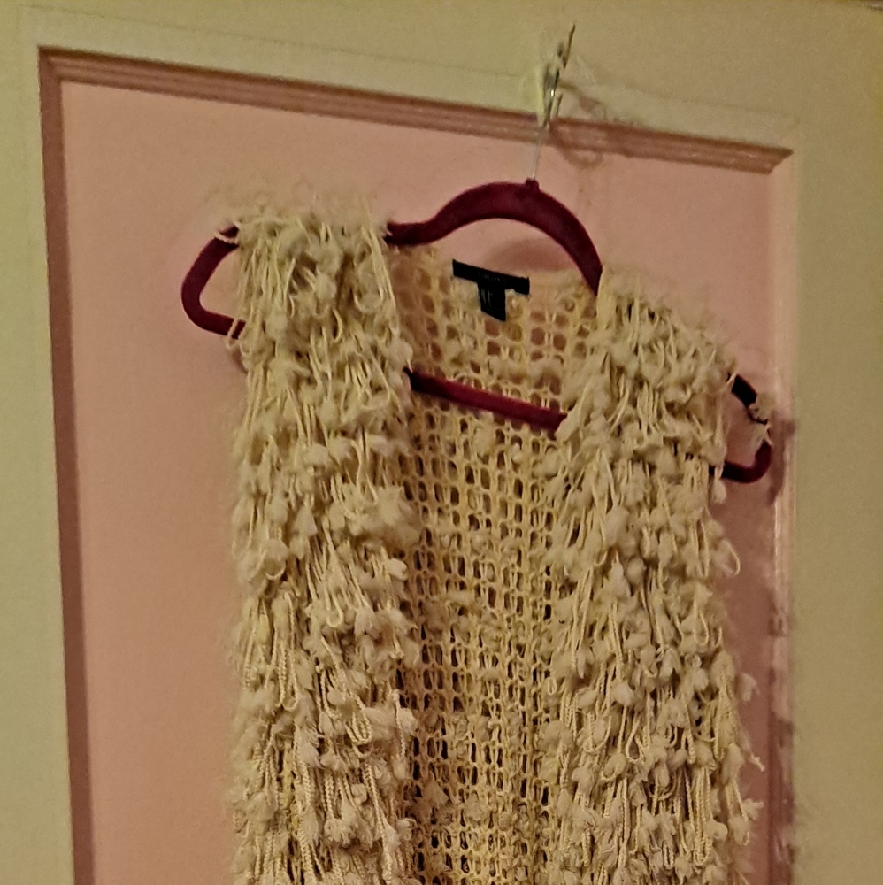 Cream colored long vest